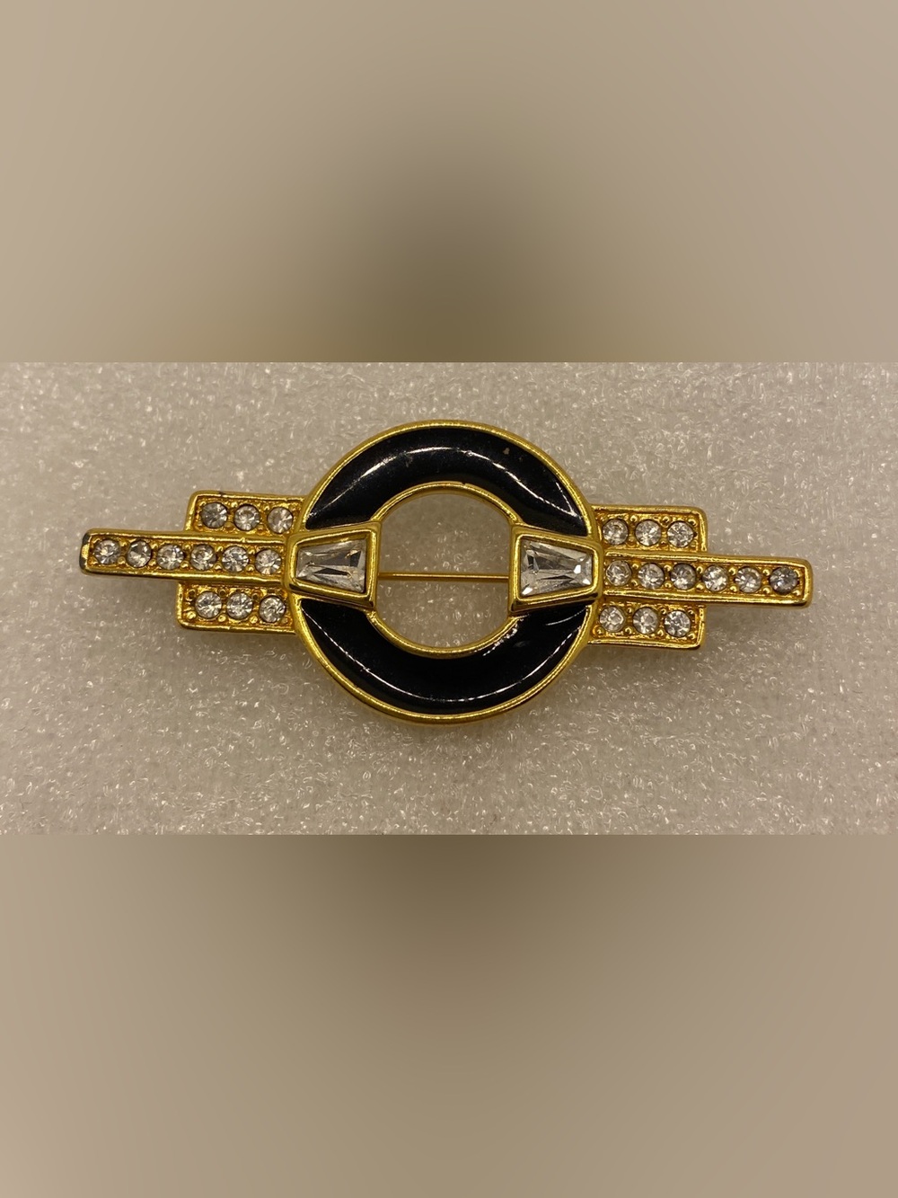 Monet Gold-Tone Black Enamel Circular Brooch with Crystal Accents